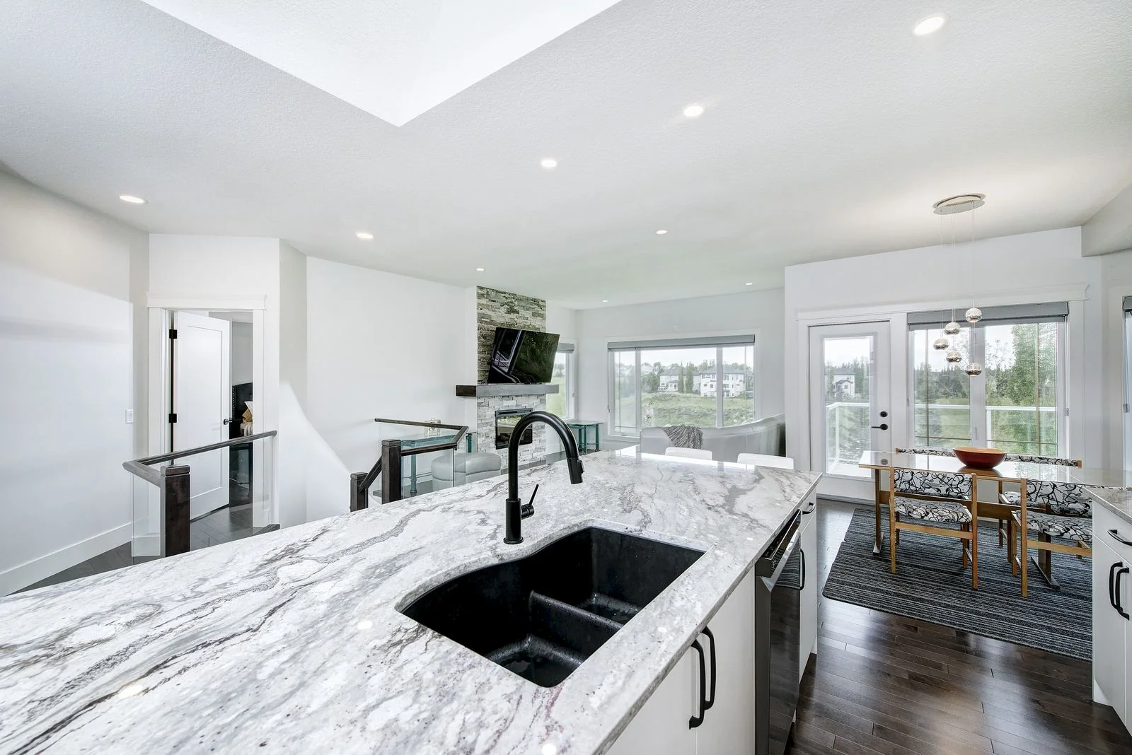 Kitchen island and sink with the dining area beyond