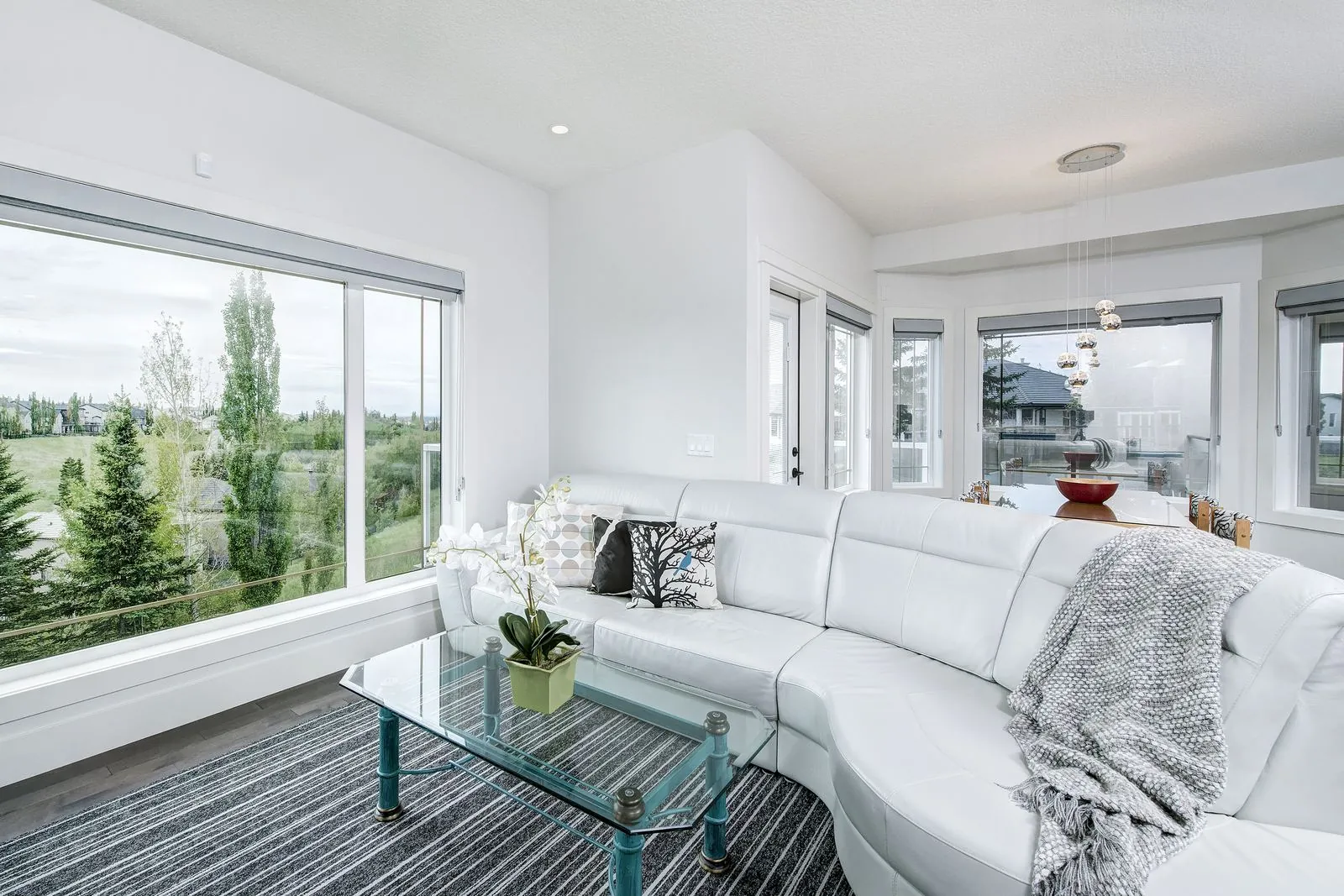 Living room sectional under a wall of windows