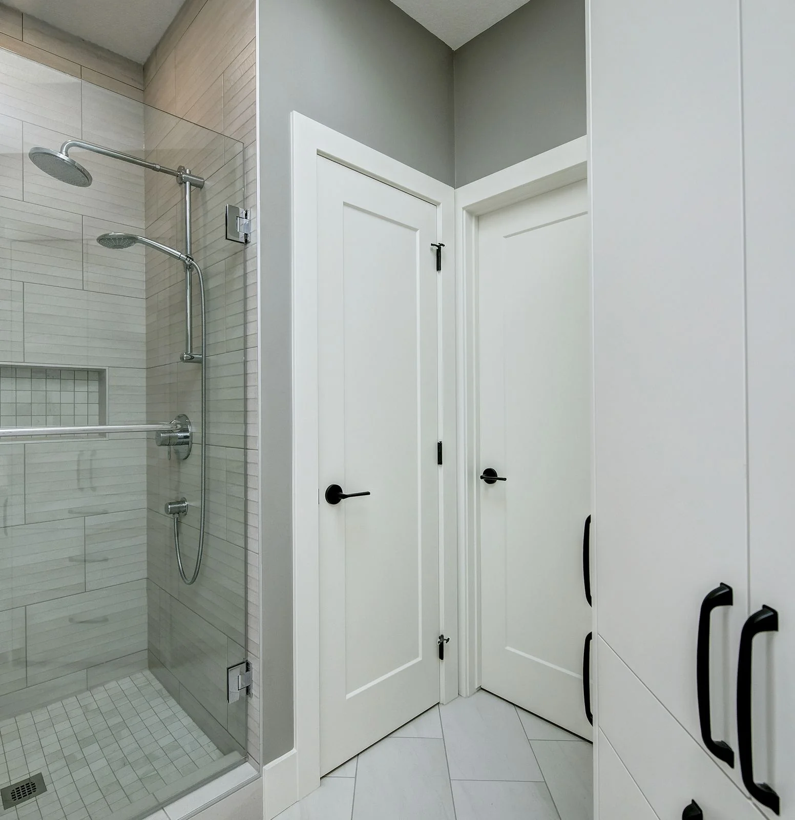 Tiled shower with a glass door