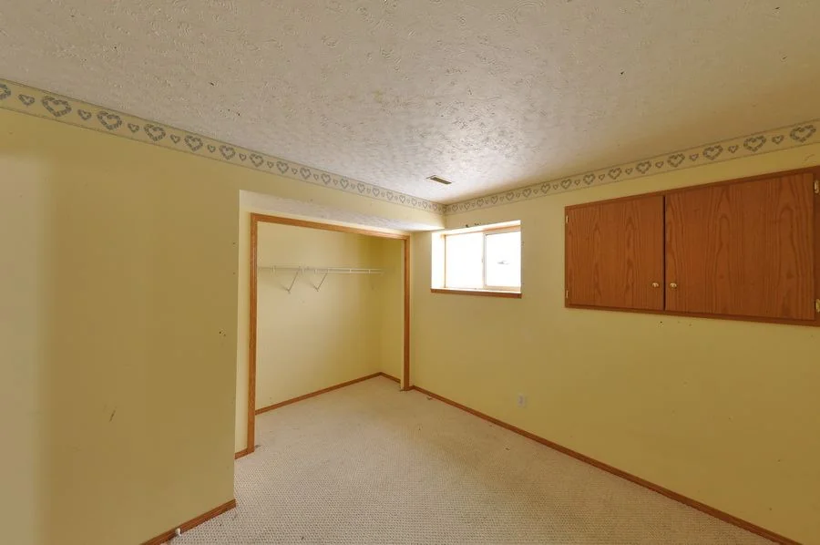 The bedroom before the work with the original wall covering in place