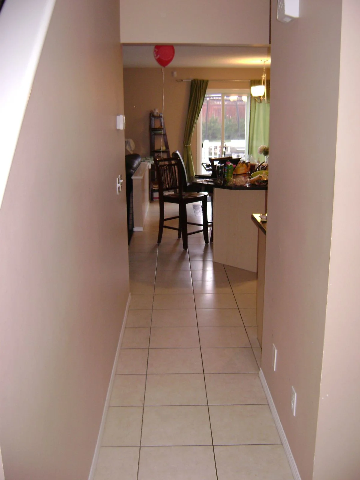 Tiled hallway looking toward the dining area before renovation