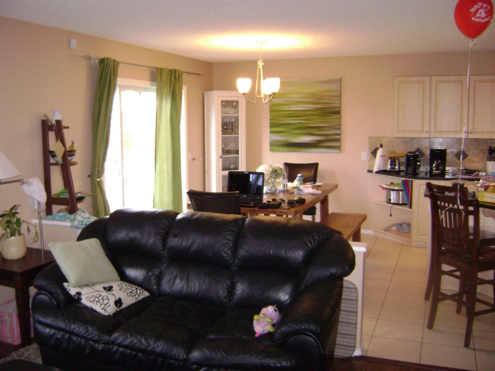 Living room before renovation with leather seating