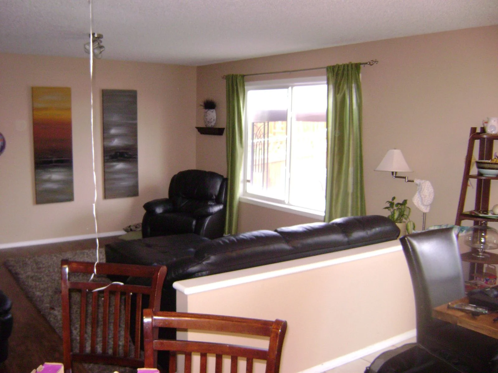 Living room before renovation with windows to the yard