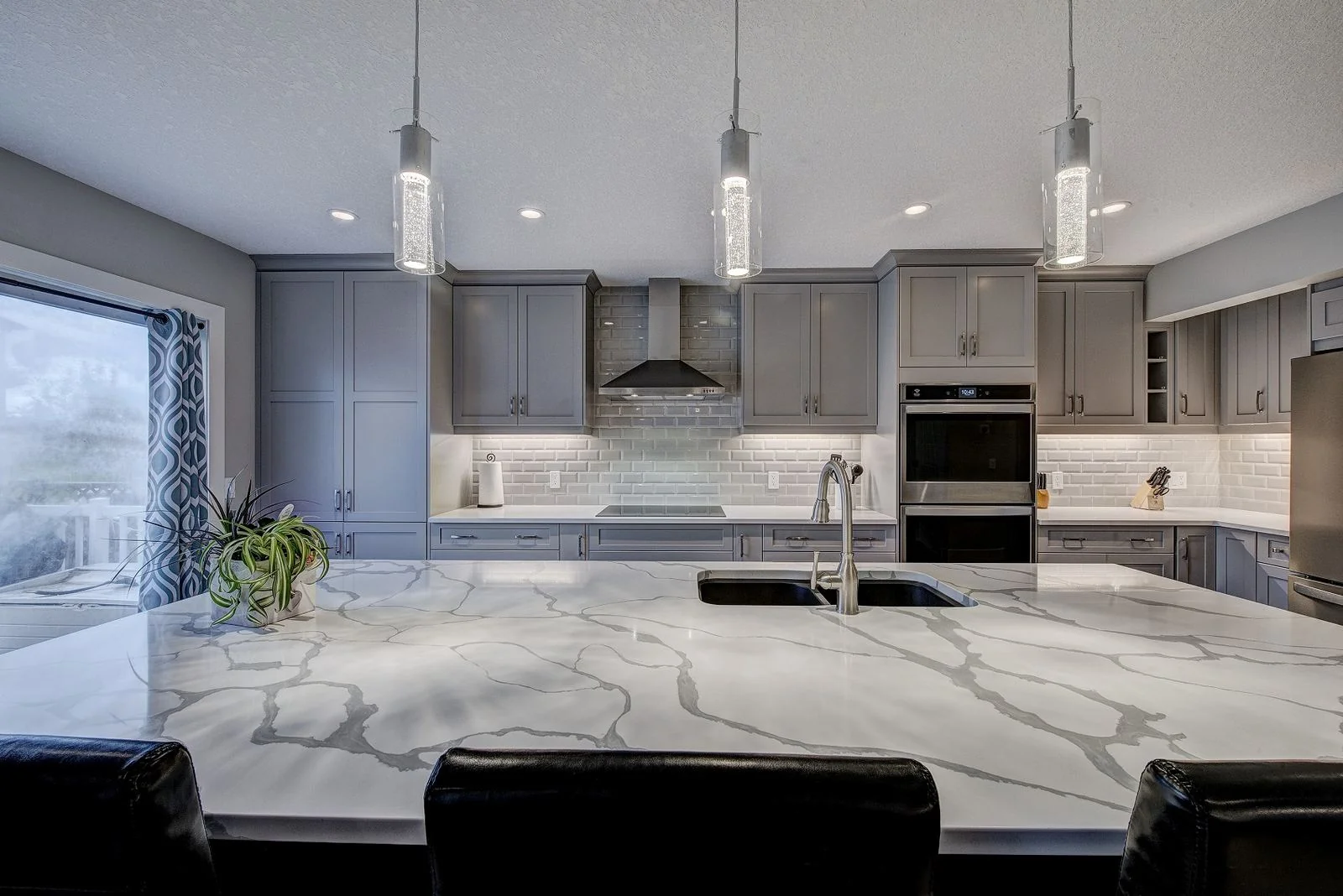 Citadel, Calgary. Kitchen island in marble patterned quartz