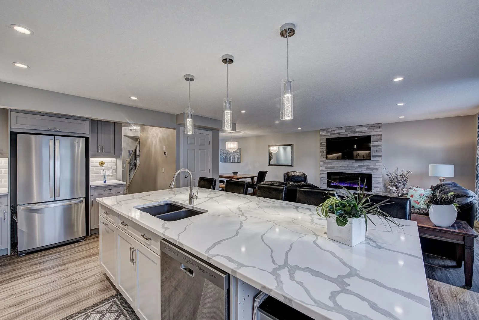 Kitchen island and stainless refrigerator