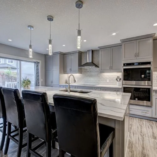 Citadel, Calgary. Kitchen with wall ovens and island seating