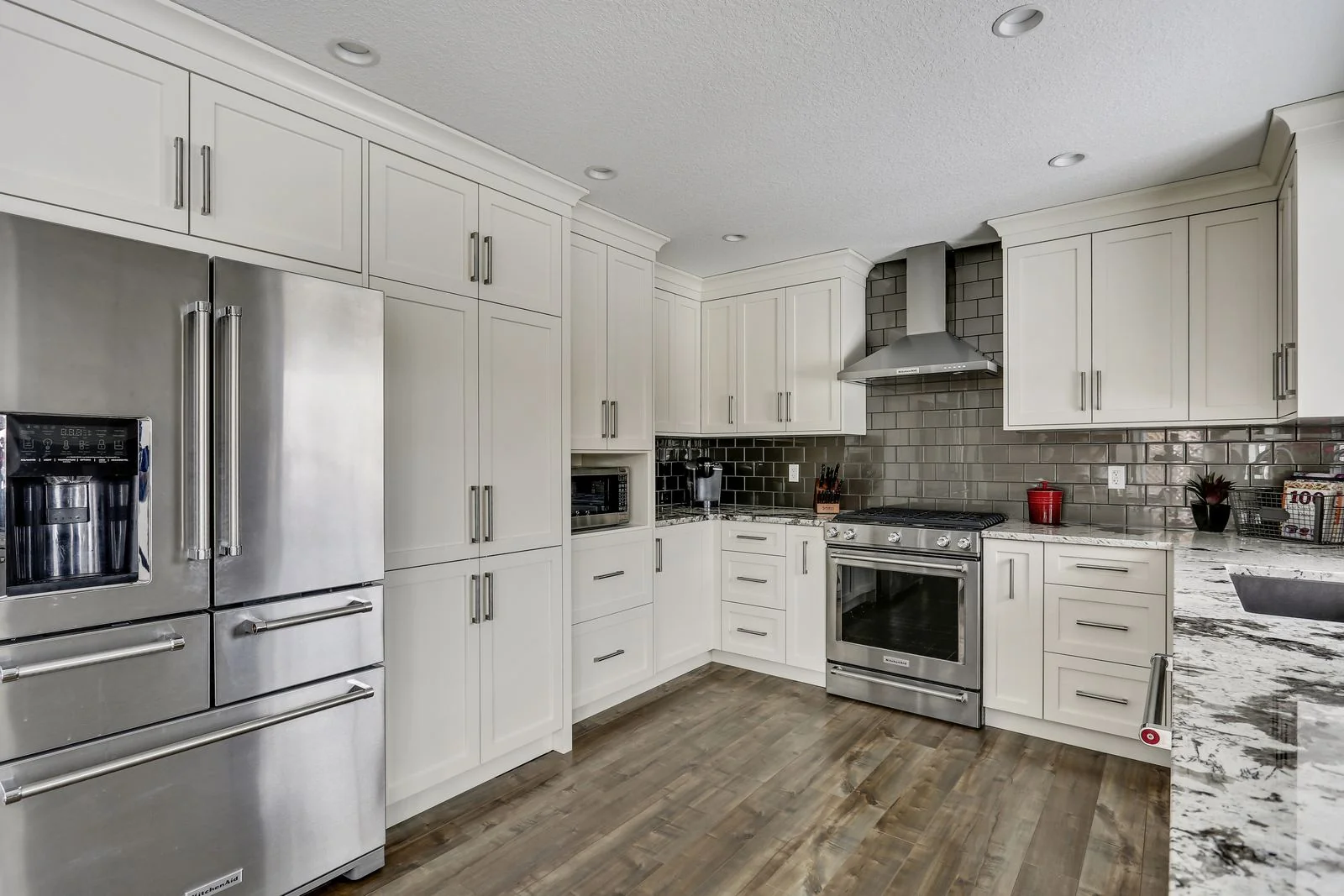 Kitchen cabinetry run with a counter depth refrigerator