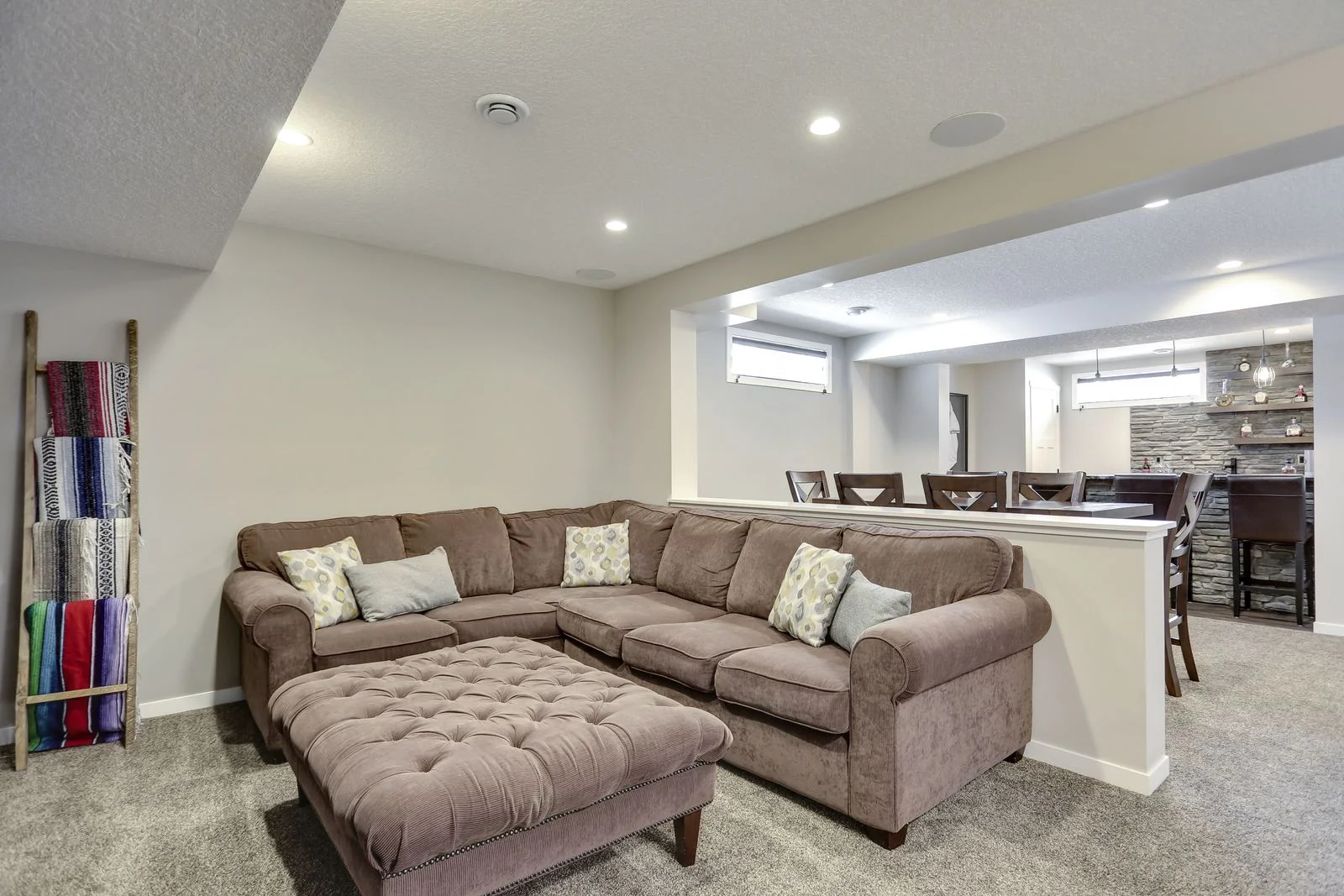 Developed basement family room with a sectional