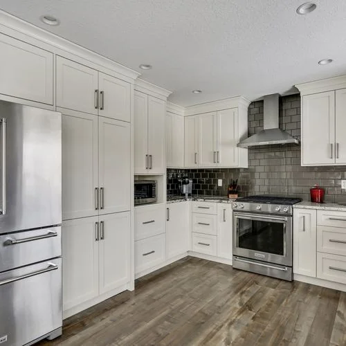 Douglas Dale, Calgary. Kitchen cabinetry run with a counter depth refrigerator