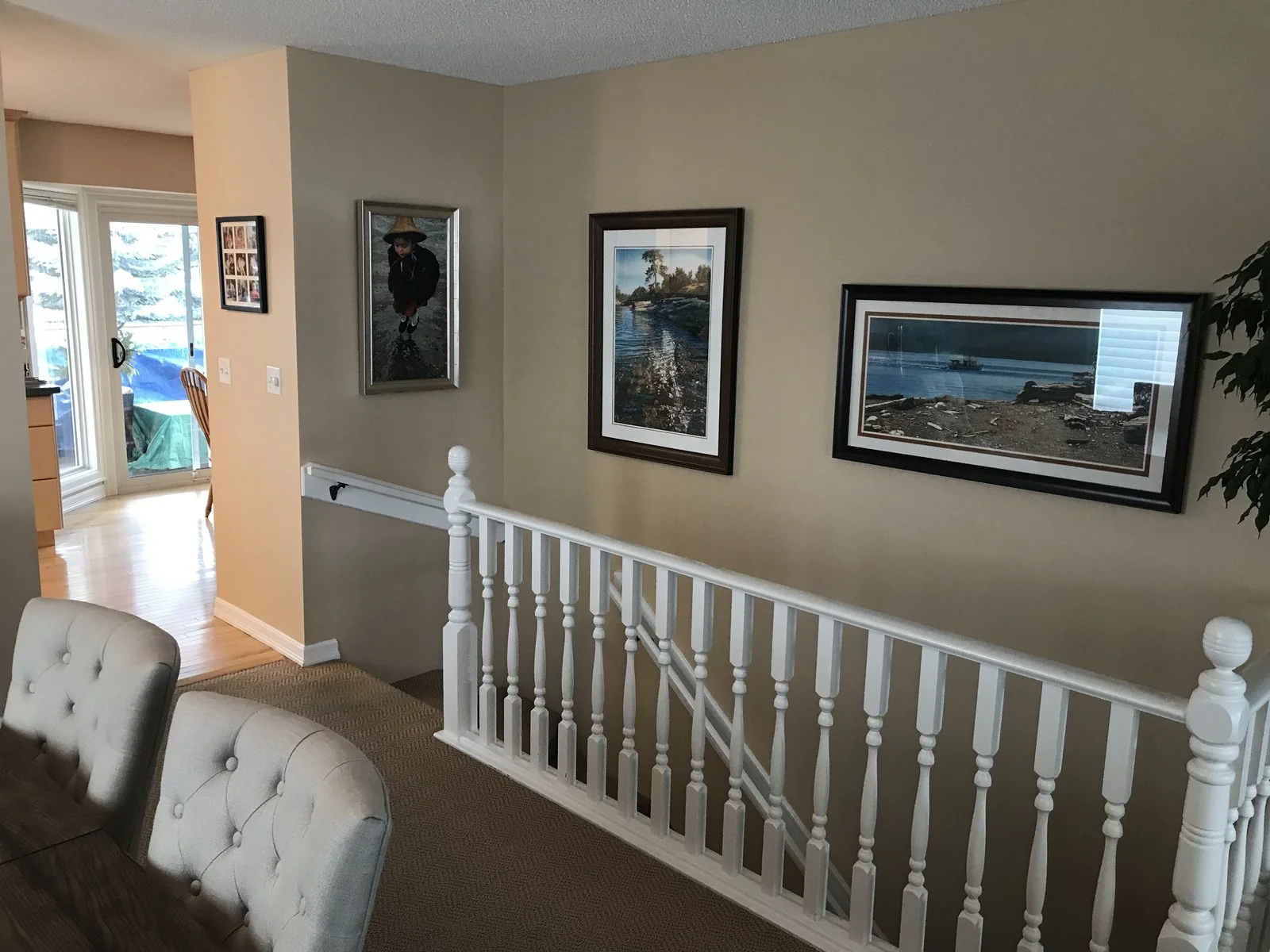 Upper hallway before renovation with the original white spindle railing