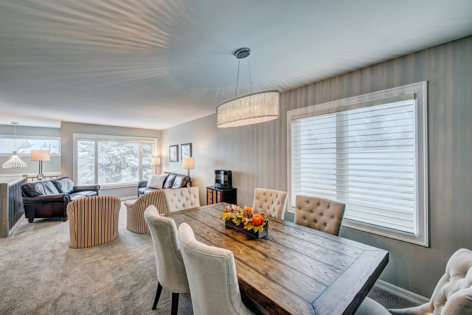 Dining room under a linear crystal chandelier