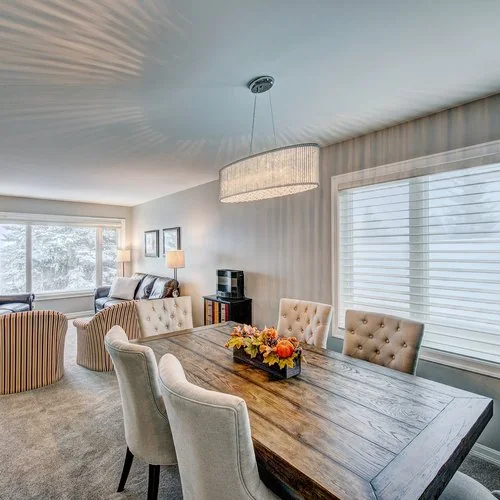 Maxwell, Calgary. Dining room under a linear crystal chandelier