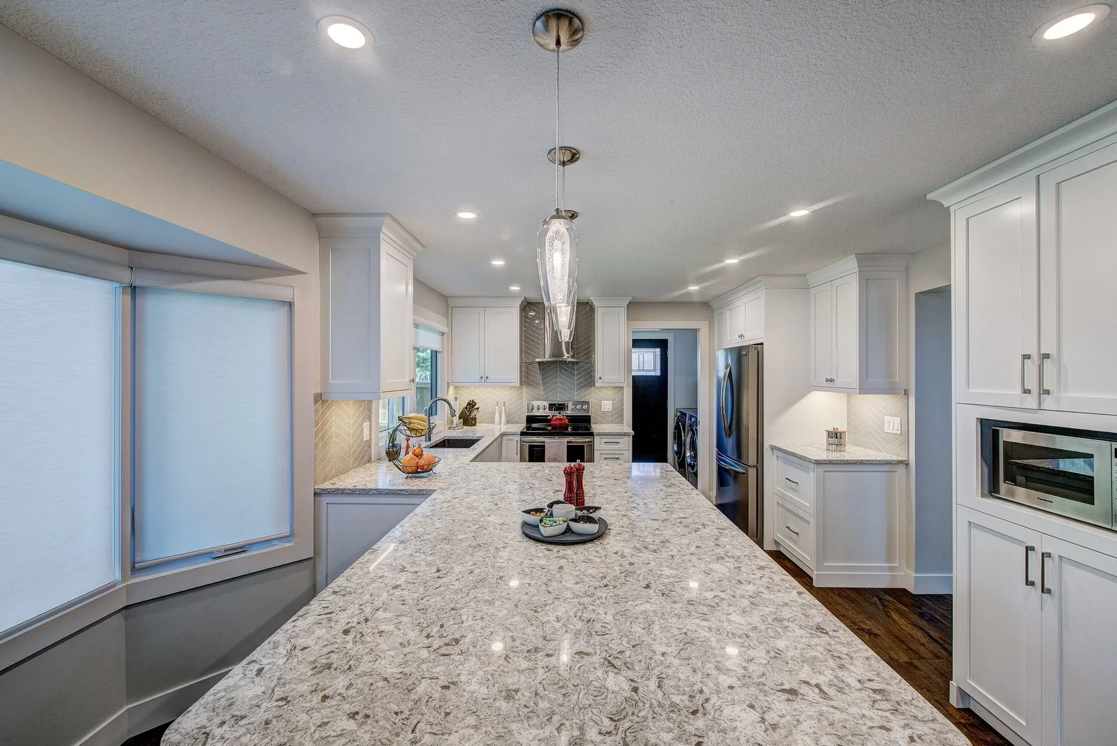 Woodglen, Calgary. Kitchen island looking toward the dining area