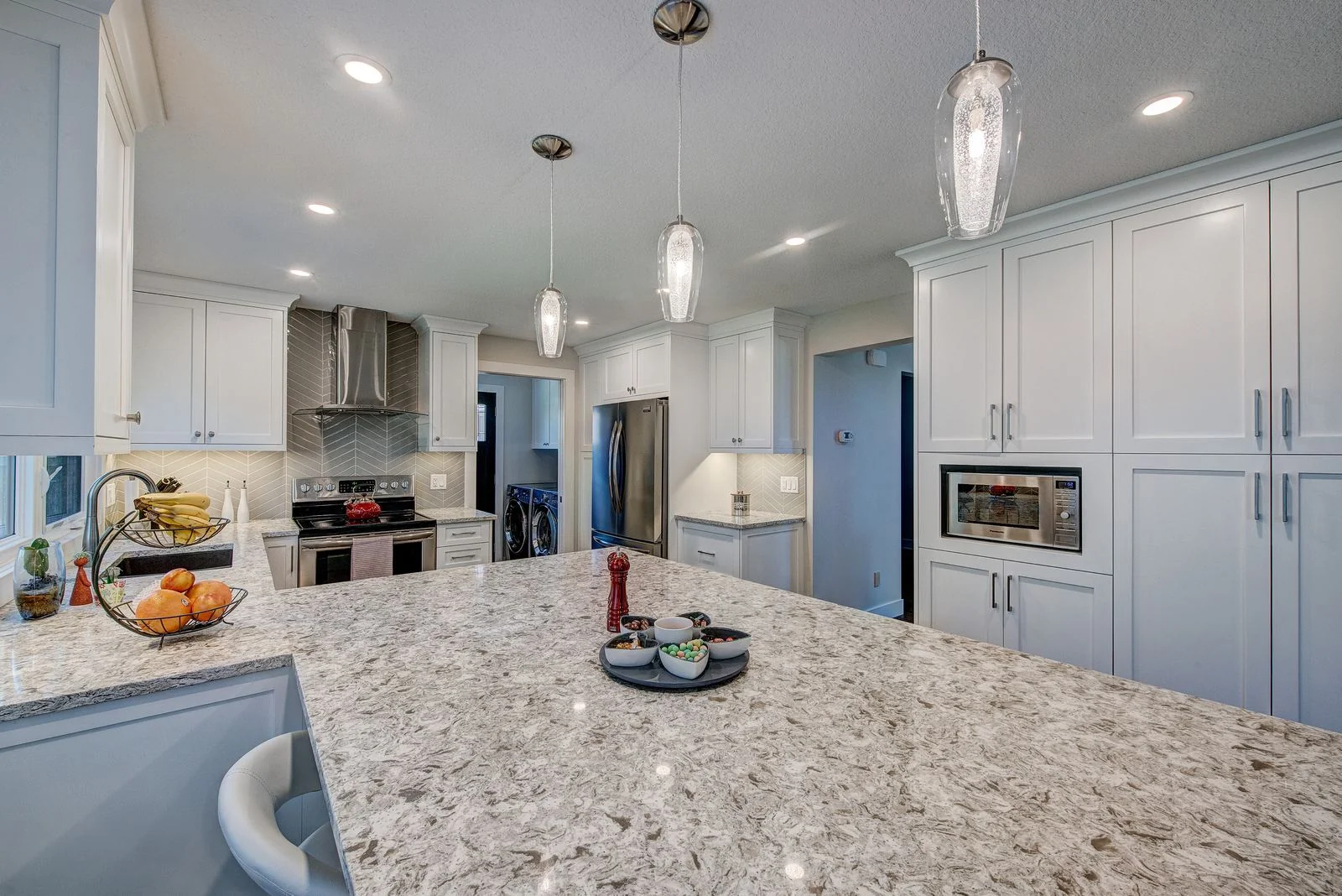 Kitchen with a wall oven and pendant lighting