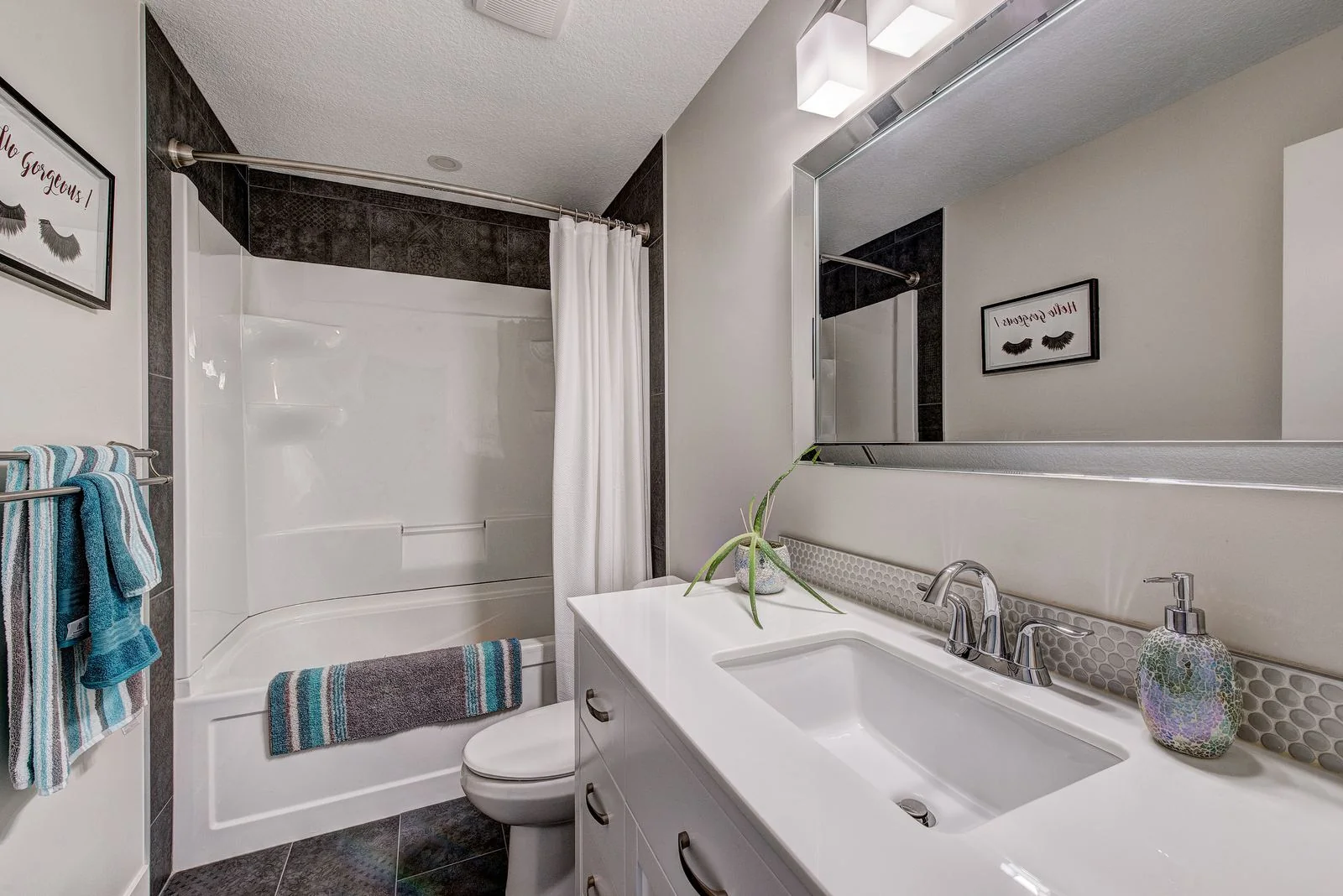 Bathroom with a long vanity and shower