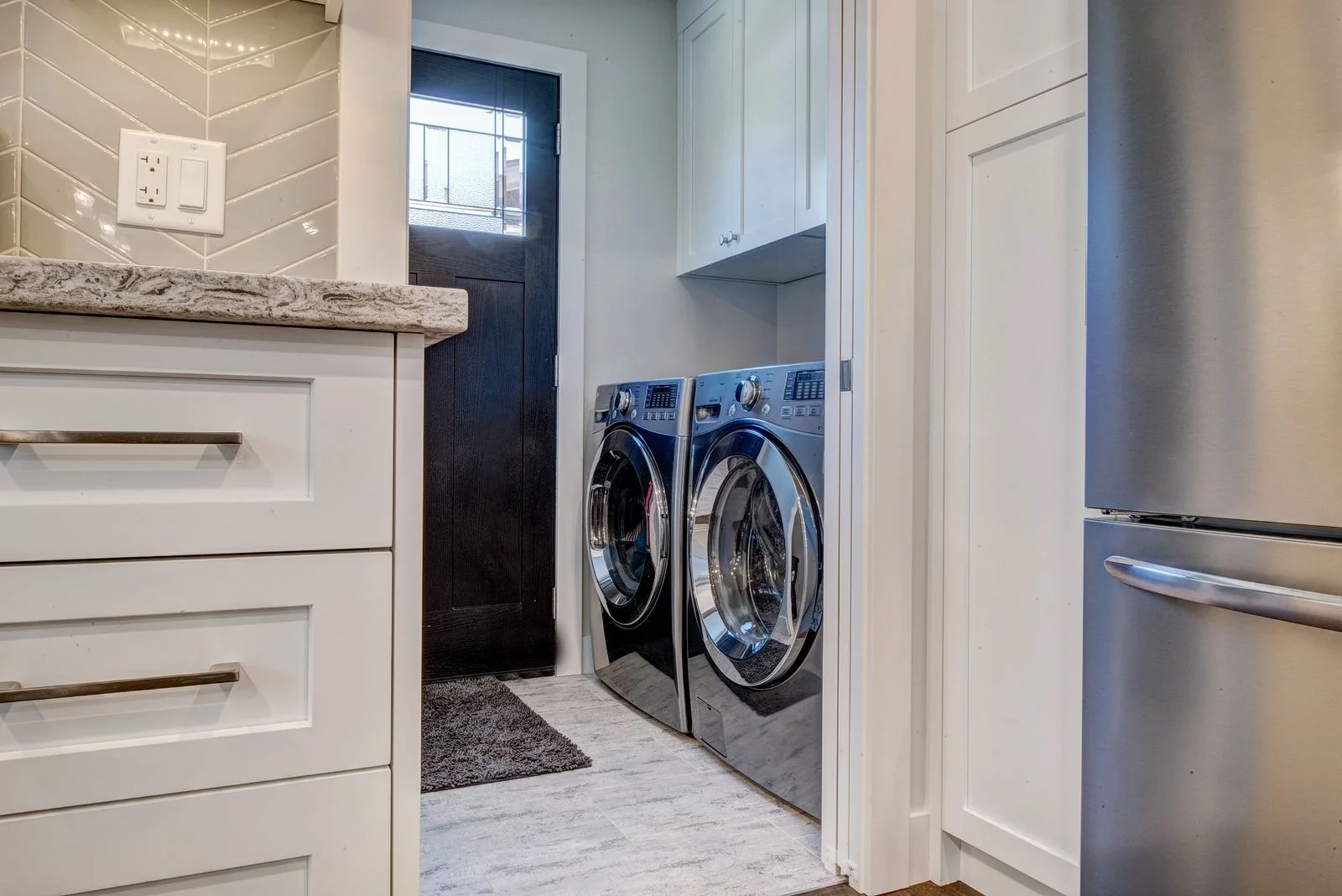 Laundry area with side by side machines