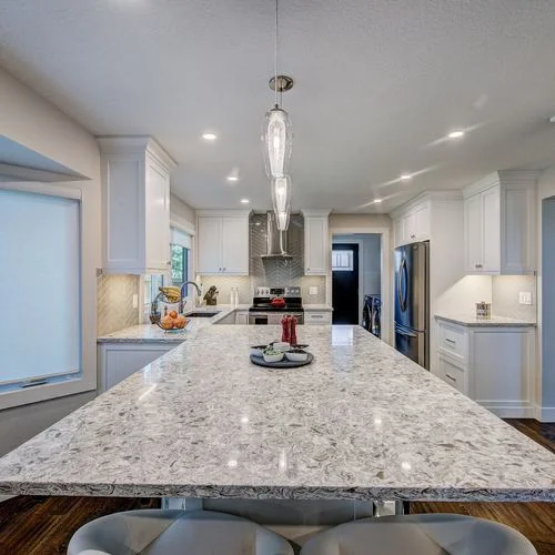 Woodglen, Calgary. Kitchen island under pendant lights