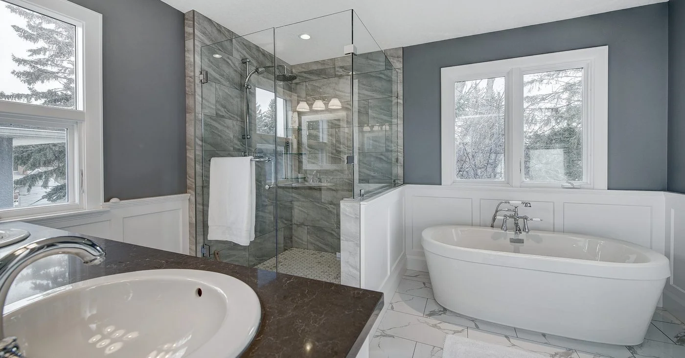 Ensuite with a freestanding tub beside a glass shower