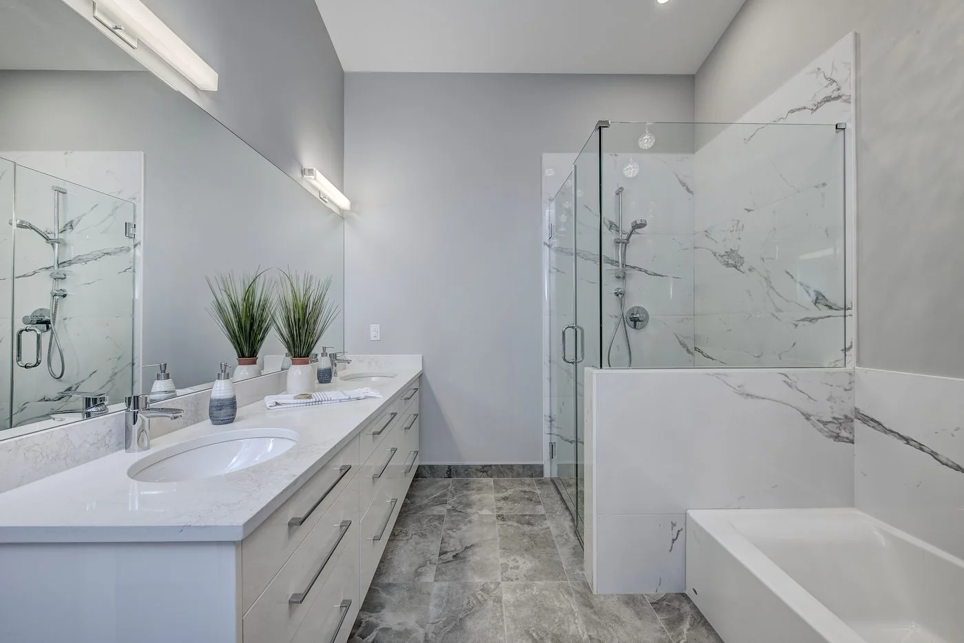 Ensuite vanity with a marble surround and walk in shower
