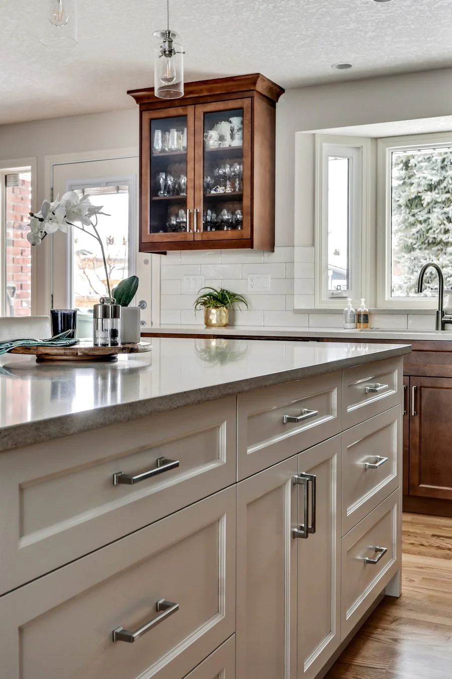 Cabinetry detail where painted and stained finishes meet
