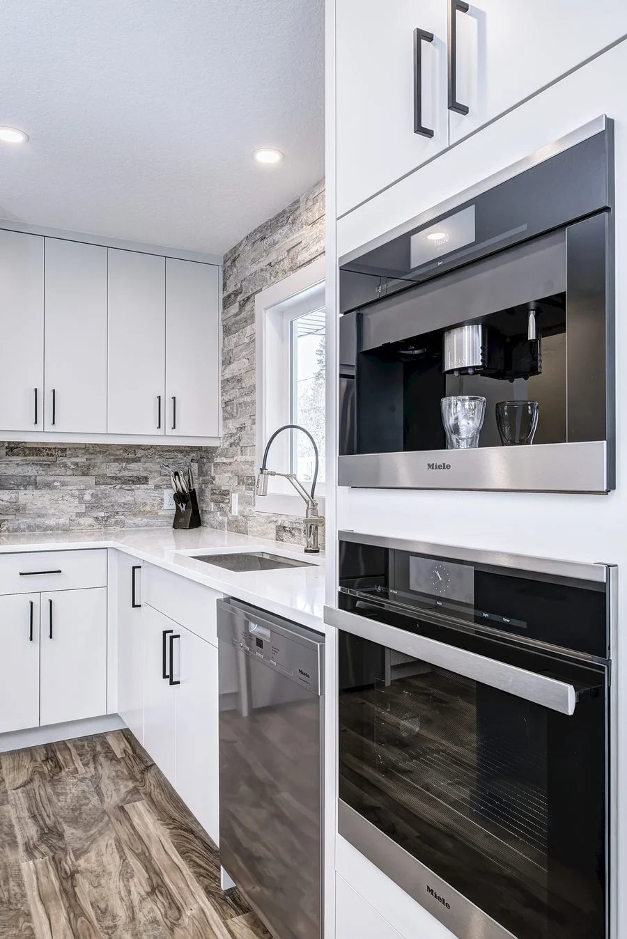 Built in wall ovens in a tall cabinetry run